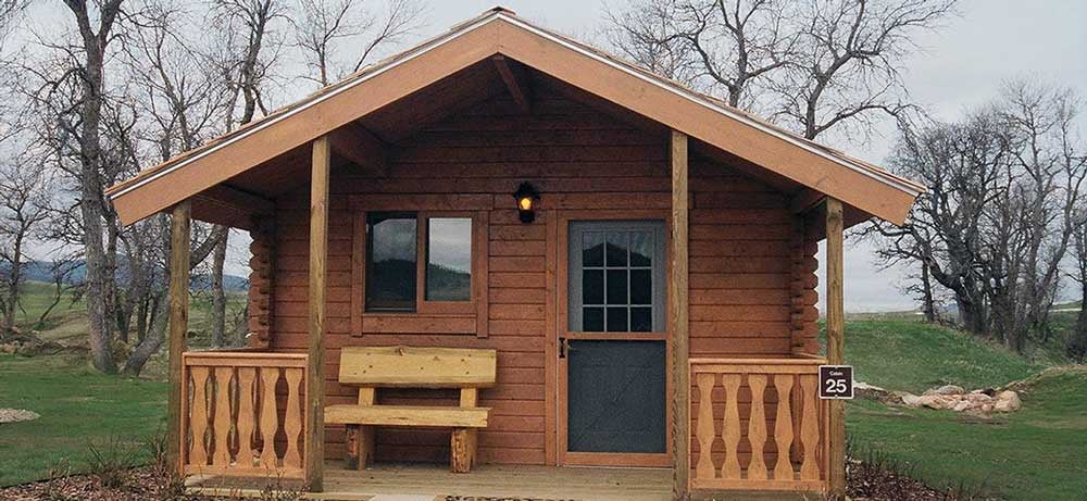 A small wooden hunting cabin