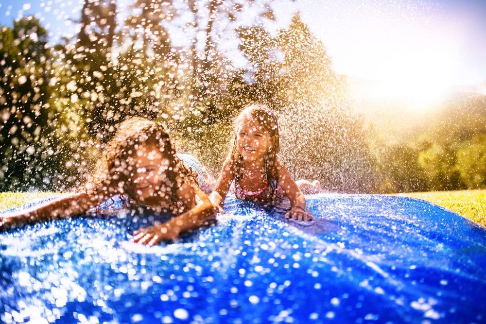 Kids on a slip and slide