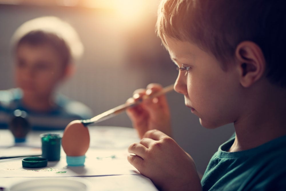 Kids painting eggs