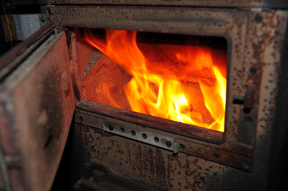 Rain tin roof woodstove fire.jpg