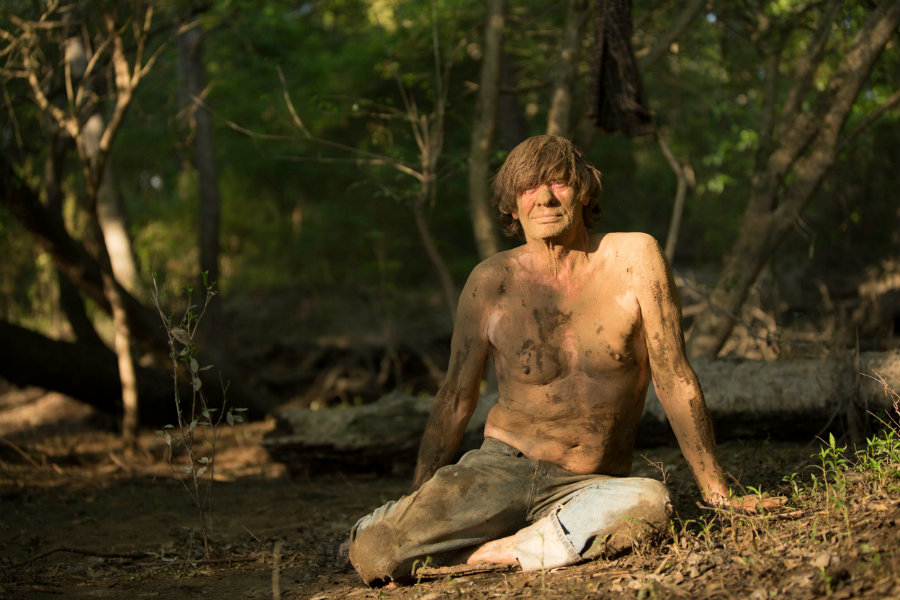 VALDOSTA, GA.- Colbert sitting on the ground, caked in mud